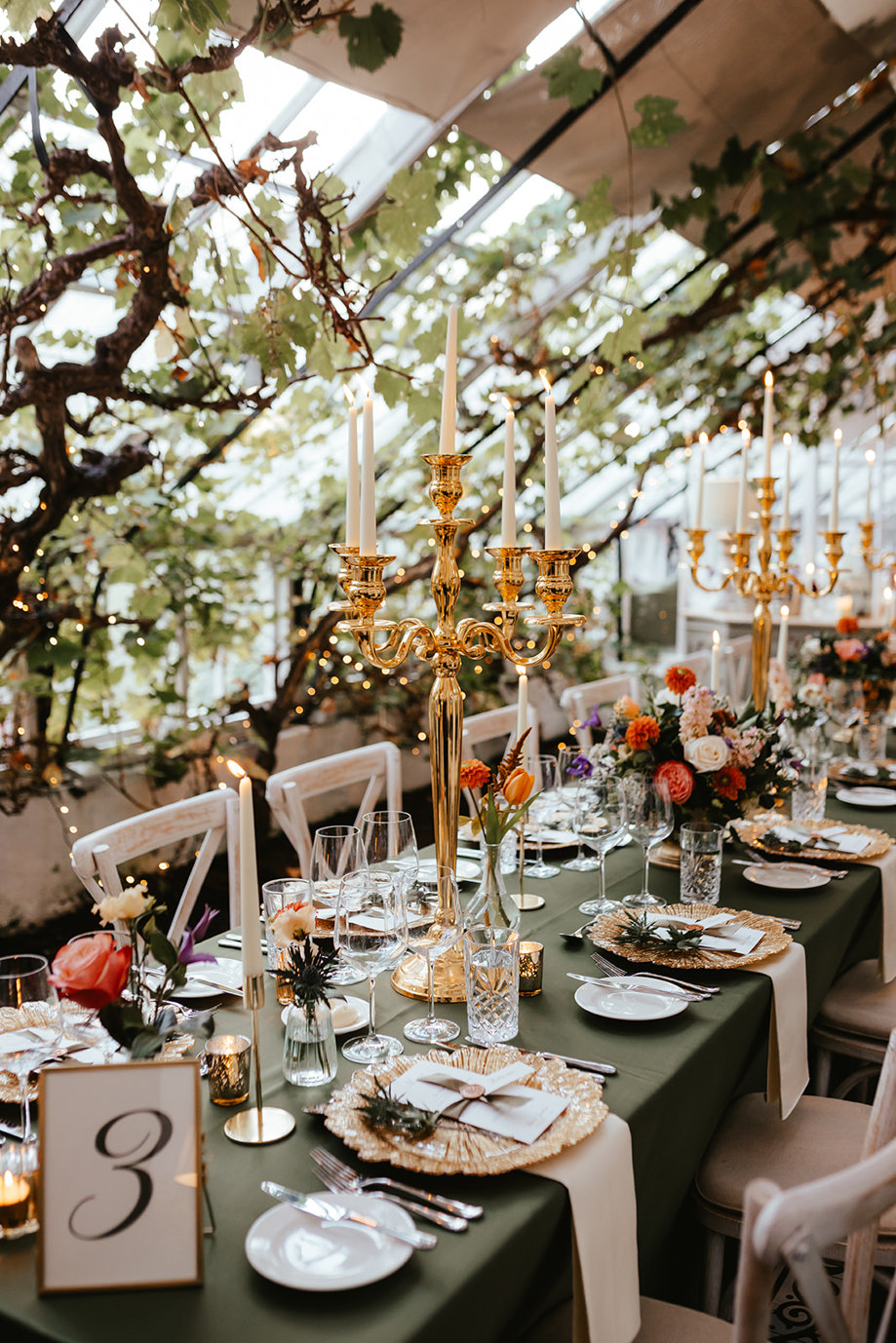 Top table with gold candelabra's and green decor